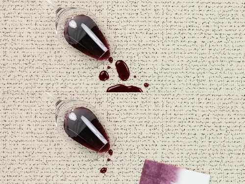 Before and after on carpet treated with Fiber ProTector: spilled red wine beads on the surface, then blots away without a stain