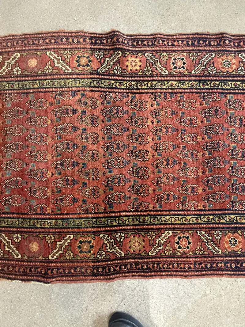 An Afghan war rug from the Soviet period with aircraft motifs at the Fiber Specialties Boise shop