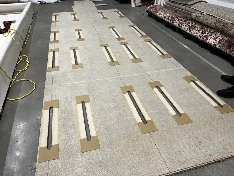 Aircraft carpet panels cut to template with hardware cutouts at the Fiber Specialties facility