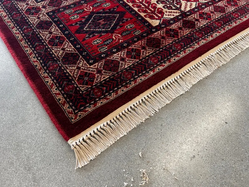 A Belgian machine-made rug with replacement fringe stitched on at the Fiber Specialties Boise shop