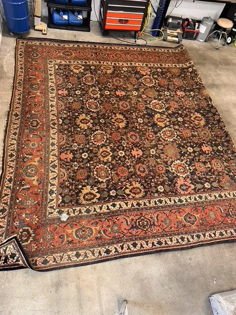 Border detail of the restored circa 1890 Bijar rug with its color recovered