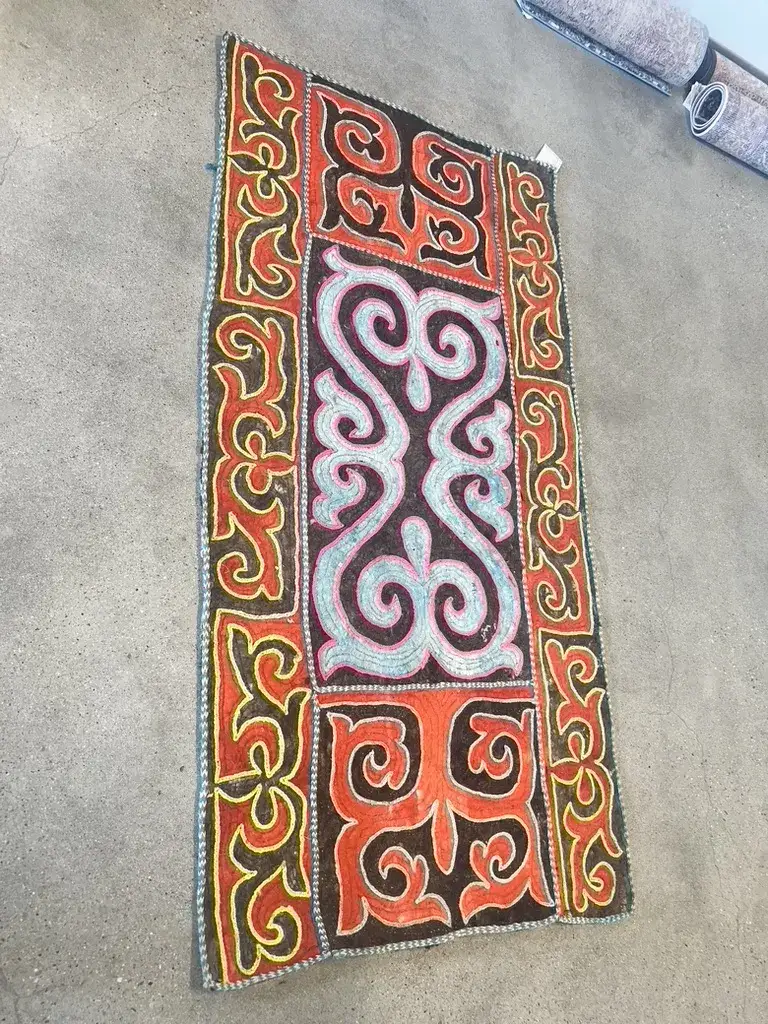A hand-knotted rug with scroll medallions checked in at the Fiber Specialties Boise shop