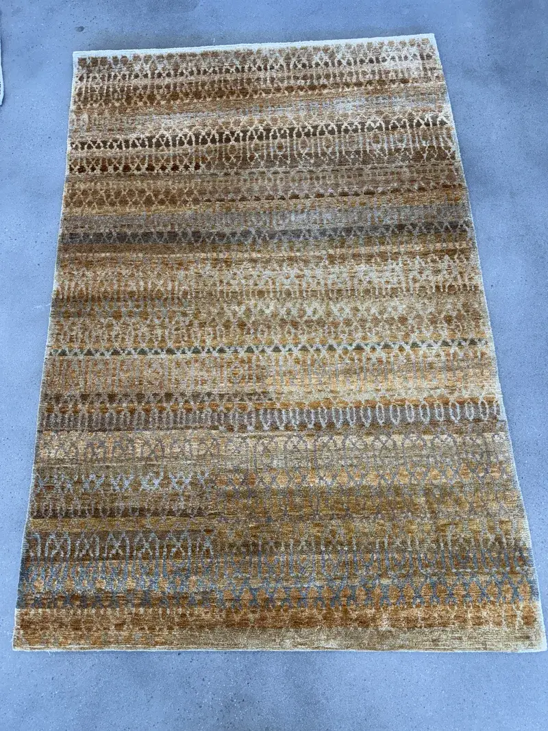 A modern transitional rug checked in for cleaning at the Fiber Specialties Boise shop