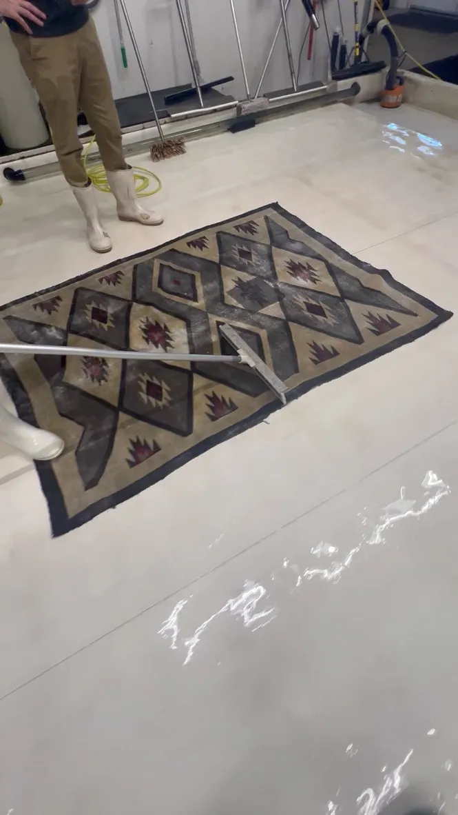 A gray diamond pattern Navajo weaving on the wash floor at the Fiber Specialties Boise facility