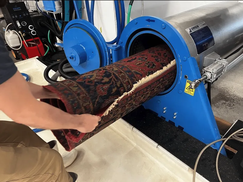 A cleaned rug in controlled drying to prevent shrinkage and color bleed