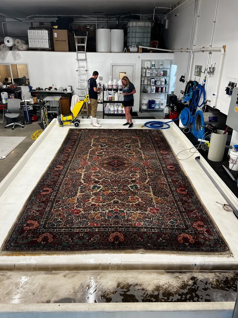 A Sarouk Persian rug during its full-immersion wash at the Fiber Specialties Boise facility