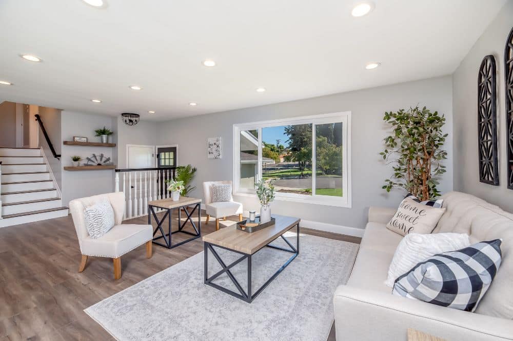 A white rug in a living room that underwent area rug restoration