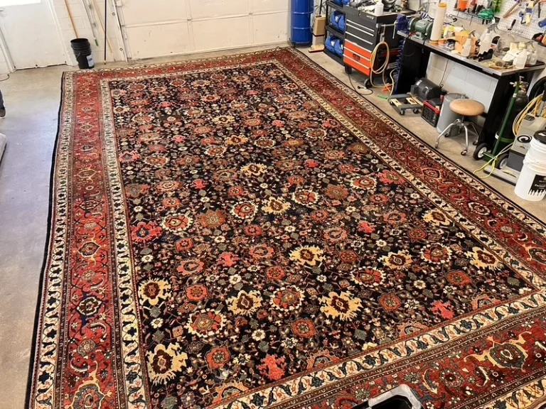 A circa 1890 Persian Bijar rug laid out flat after washing and restoration at the Fiber Specialties Boise facility